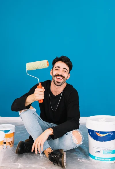 smiling-man-showing-paint-roll